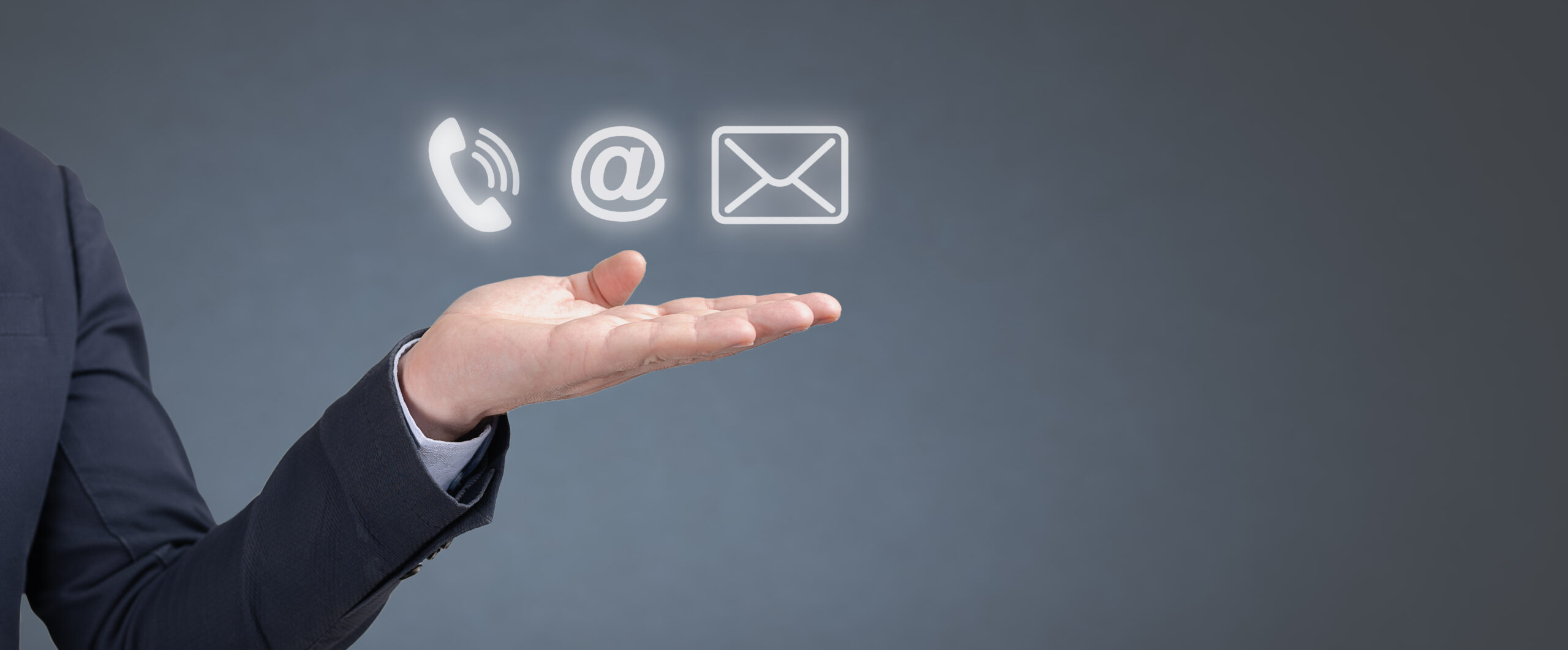 CONTACT US Methods. Hand businessman hold Phone, Email and Post Icons. Businessman hand holding icon mobile phone, mail, telephone and address. Customer service call center contact us concept
